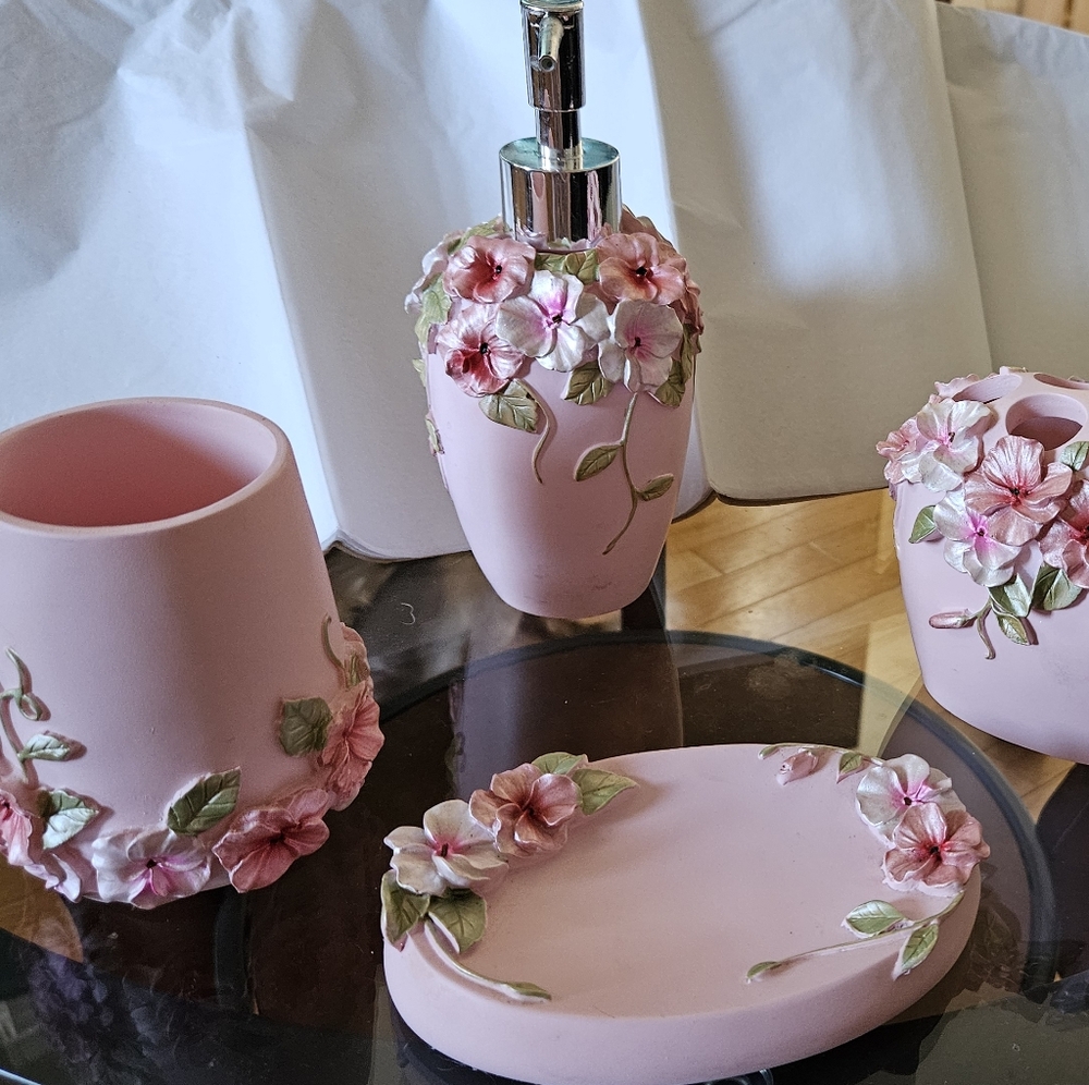 4 piece bathroom accessories.  Soap dish, toothbrush holder, cup,and lotion disp